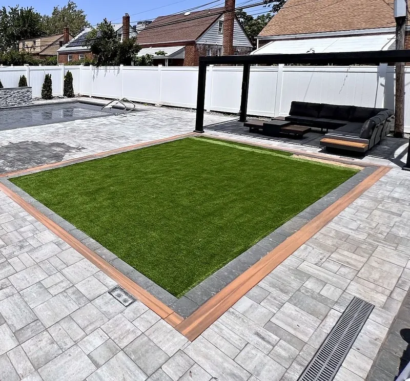 Paving & Concrete – Paver patio, turf lawn with border, channel drain and the pergola lounge