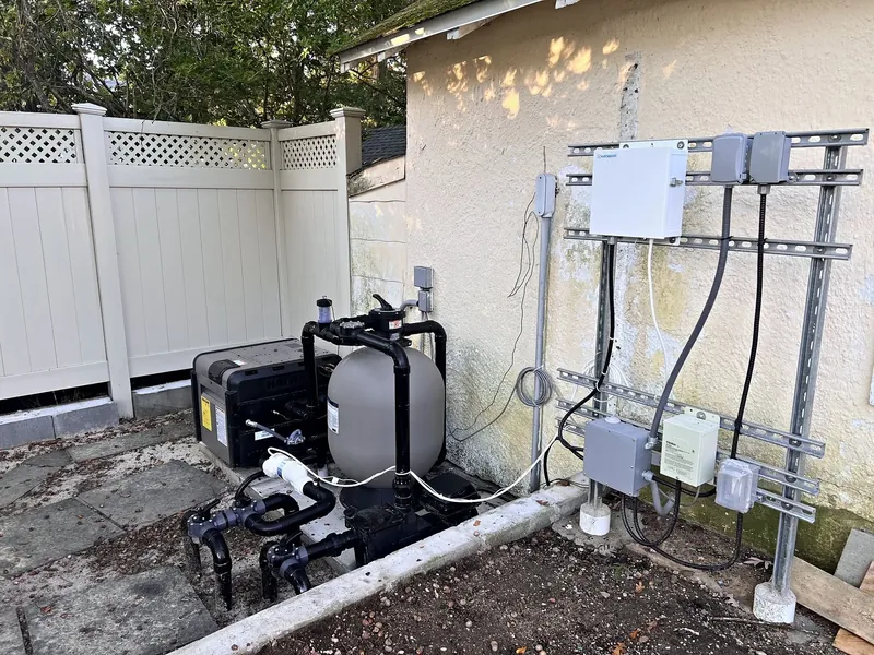 Equipment pad with gas heater, sand filter and pump, and the electrical rack on unistrut