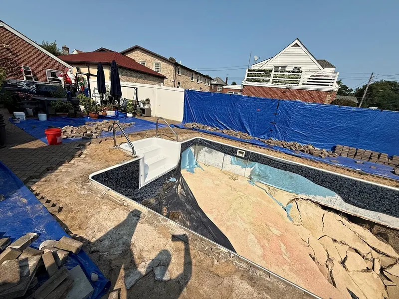 Pool opened up for the structural wall and floor rebuild