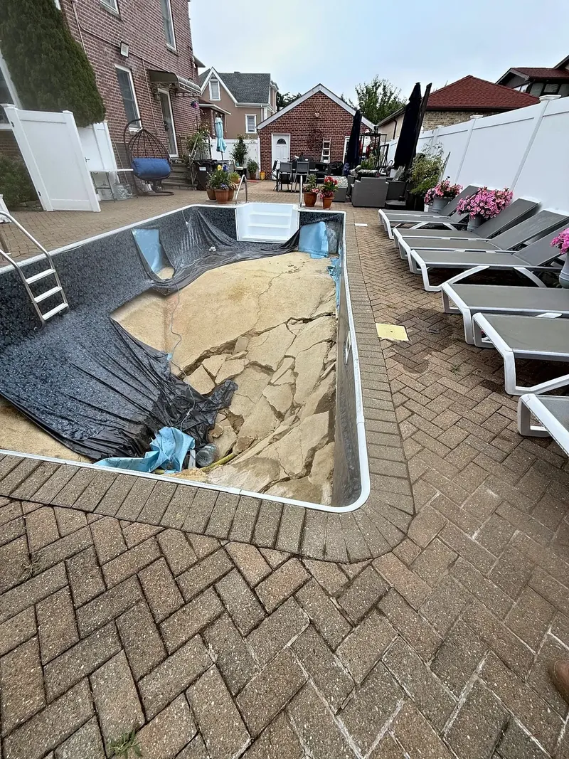 The existing pool before the rebuild – failed liner and floor