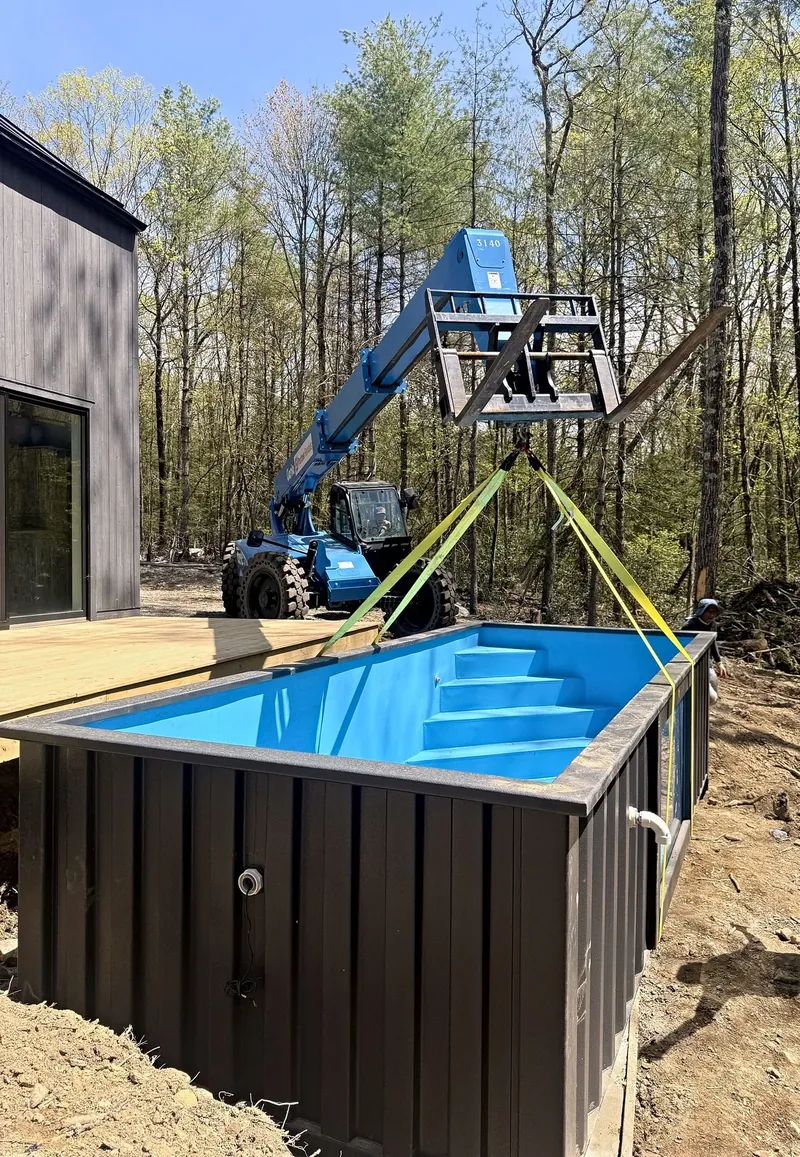 The container pool lifted into place by telehandler