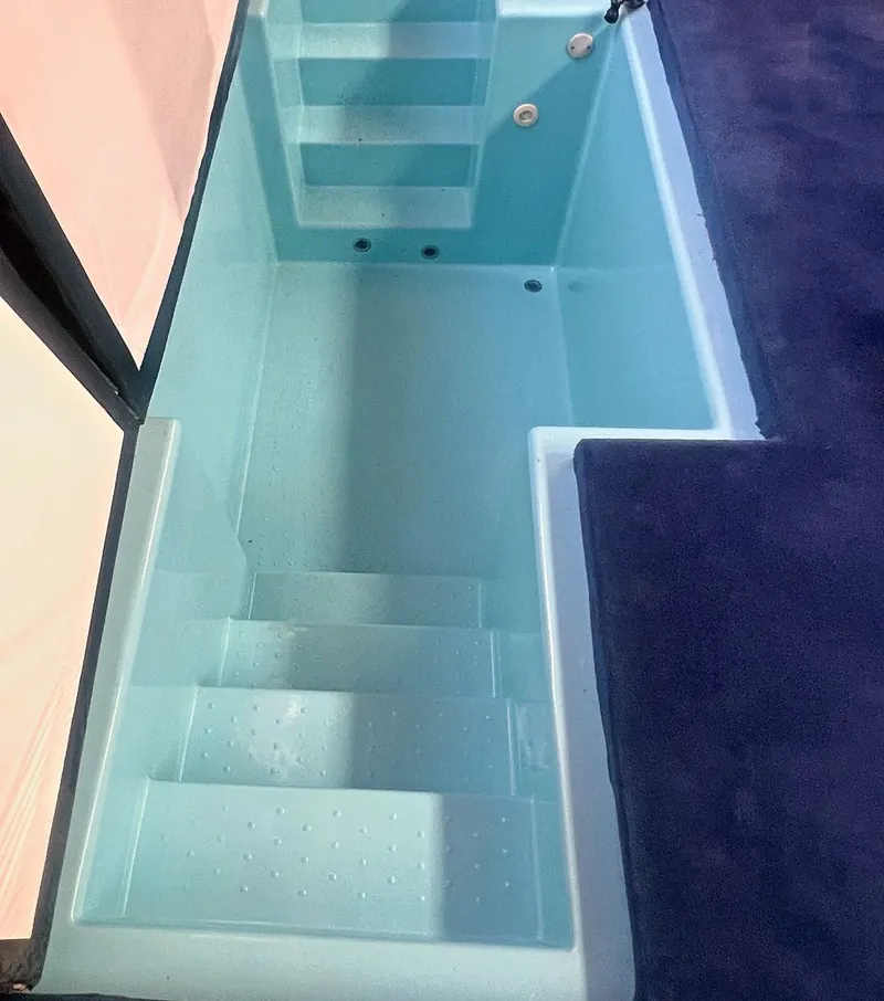 The church baptismal pool with entry steps and return jets