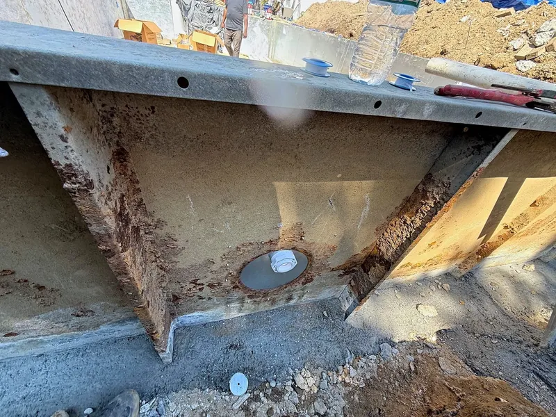 Wall panel and new main drain during the floor rebuild